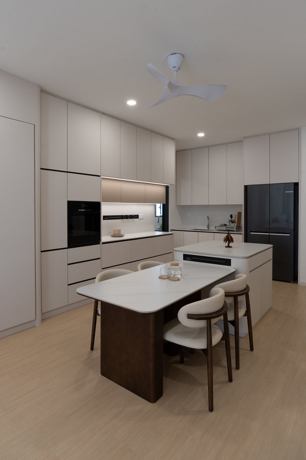 Kitchen island and full-height cream cabinets, condo interior design KL
