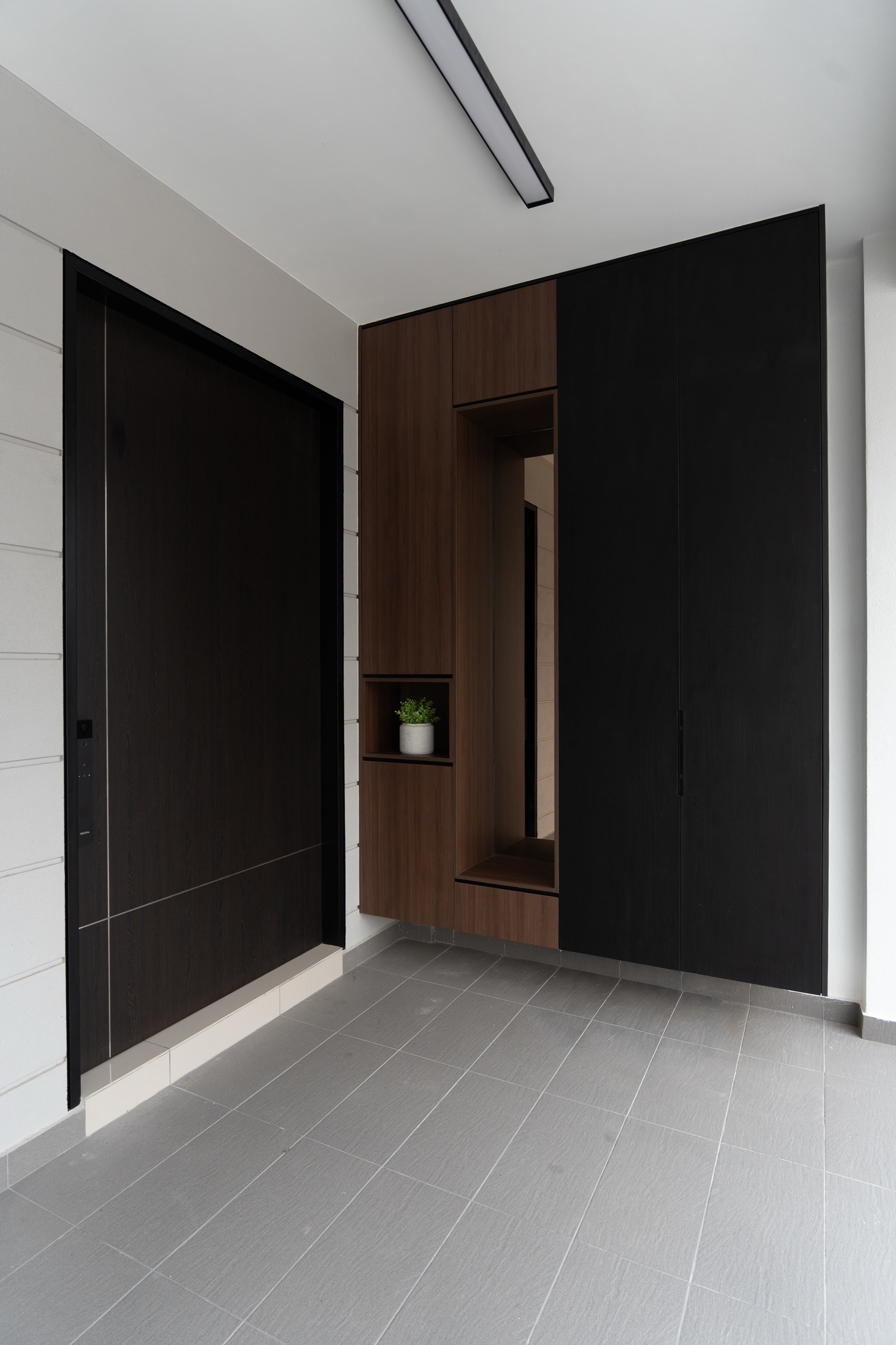 Foyer shoe cabinet in walnut and black with mirror niche, Bukit Puchong landed home