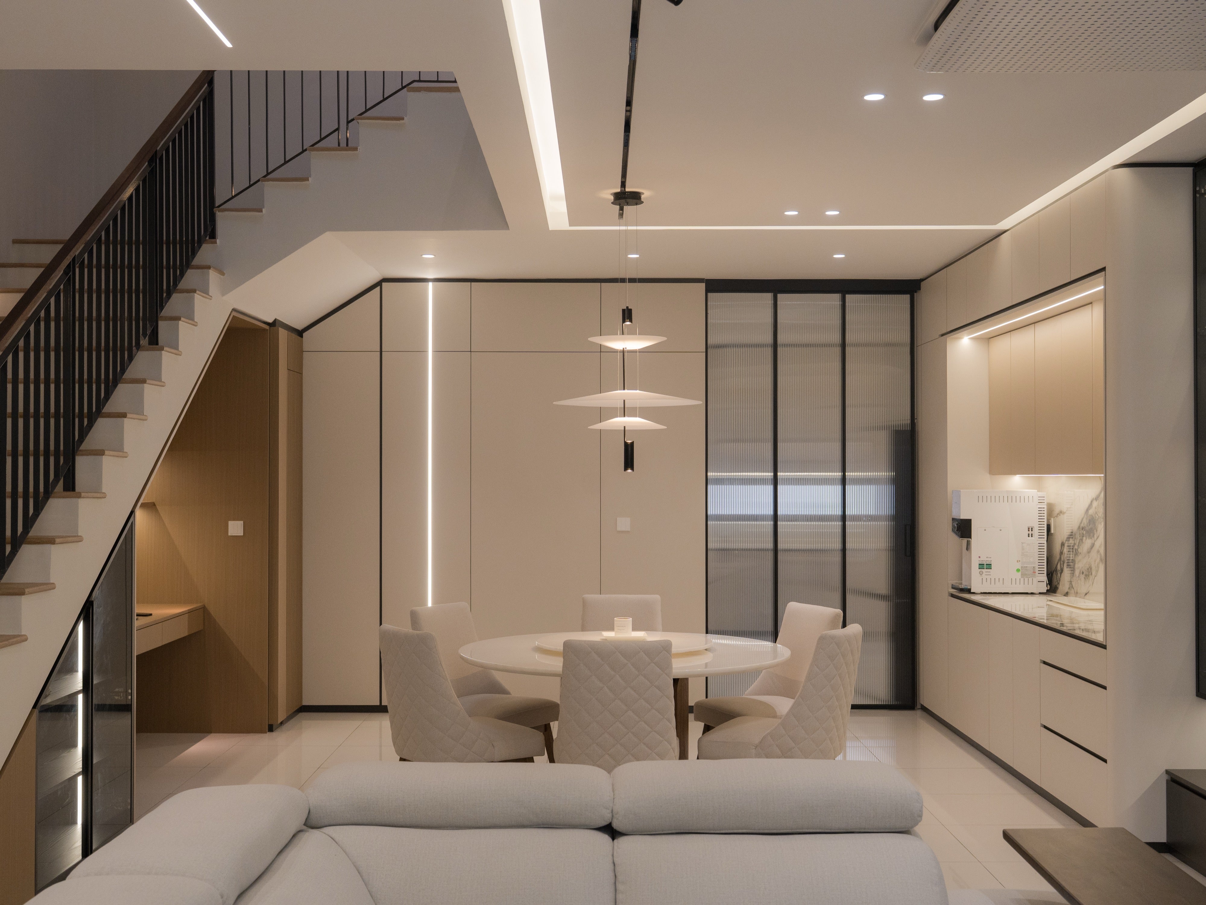 Staircase and dining area of a 3 storey landed home interior design at Taman Puchong Legenda
