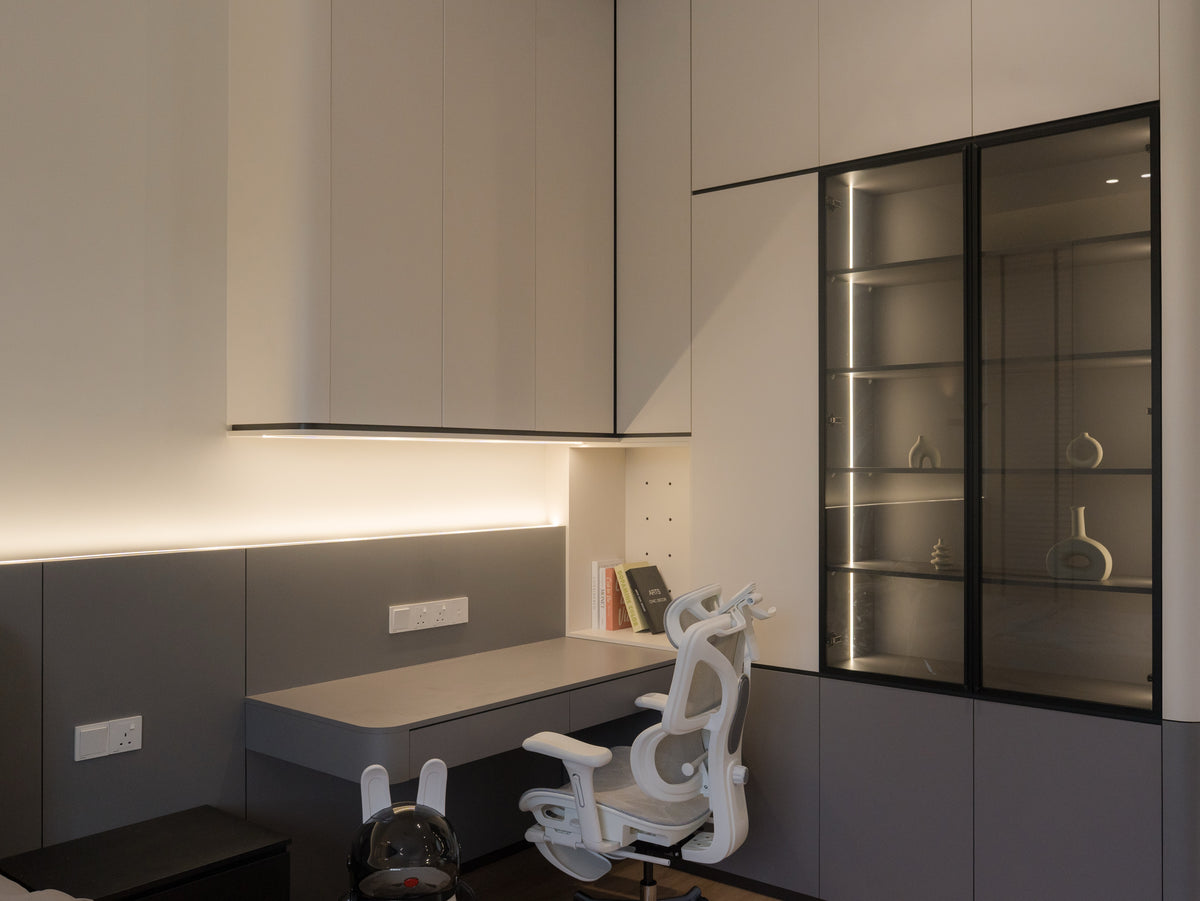 Study room with built in desk and glass display cabinet