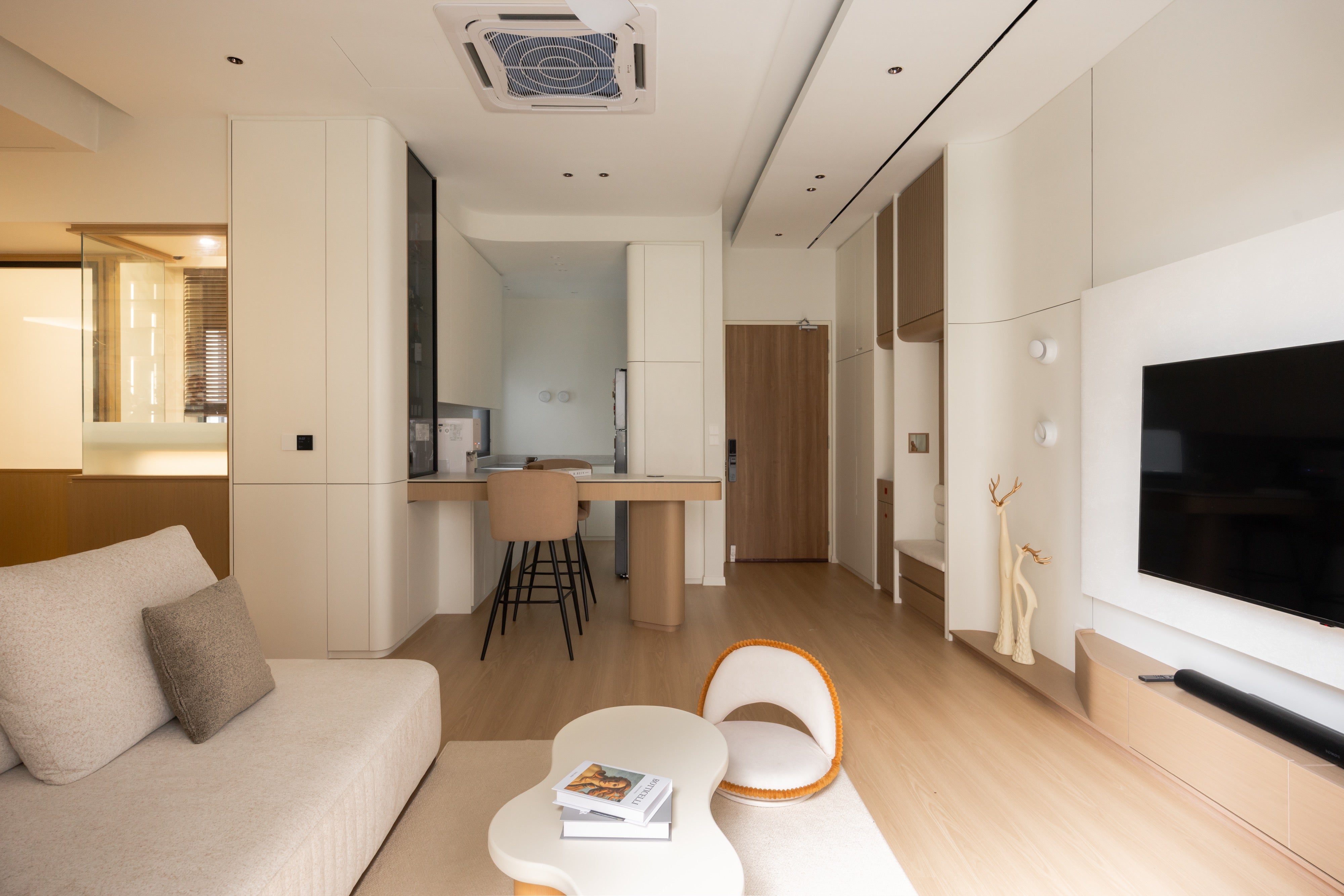 Open plan living, curved bar island and kitchen in a 1,048 sqft condo at Alira Residences, Subang Jaya