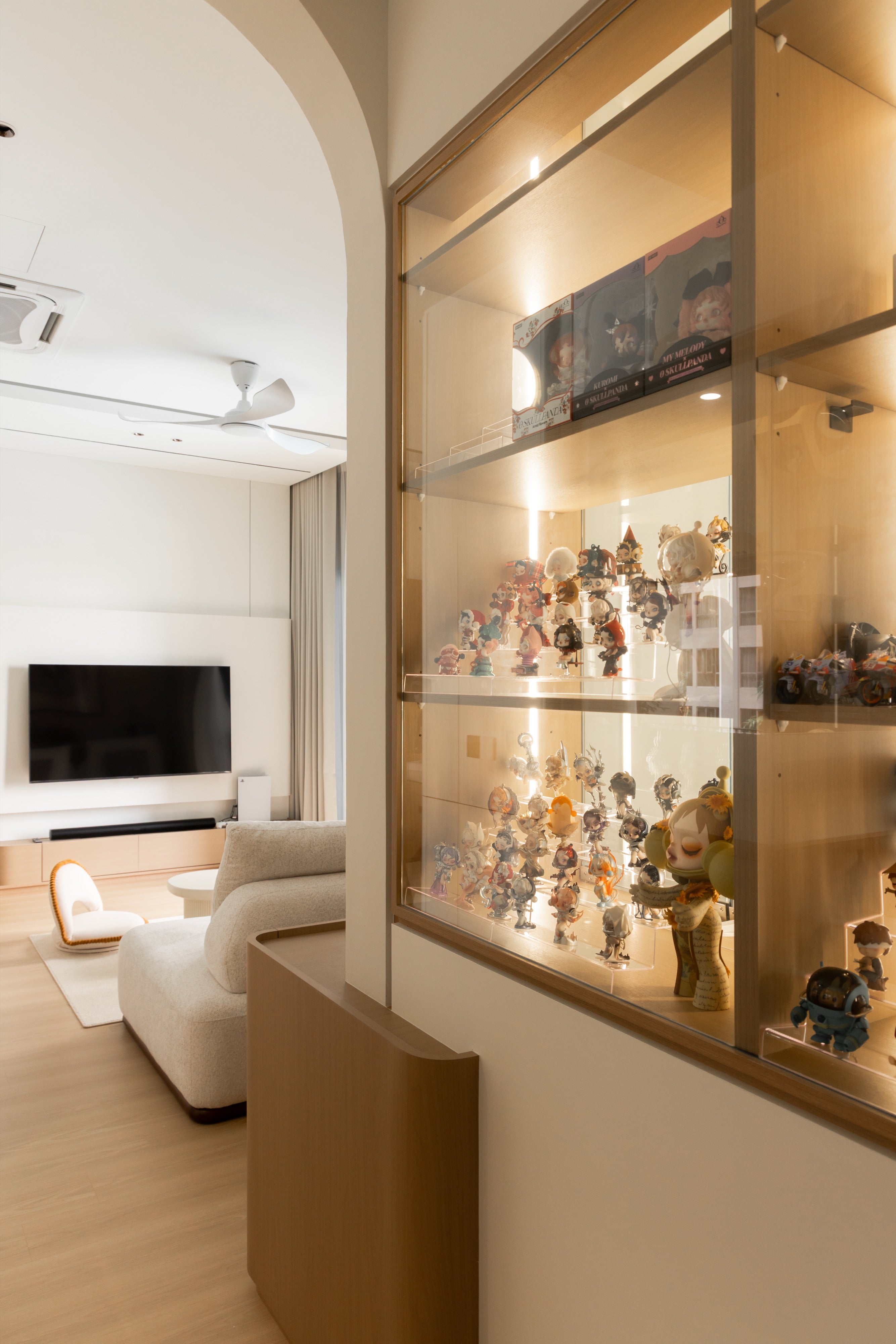 Glass-walled cat room beside the living hall with arched display cabinet