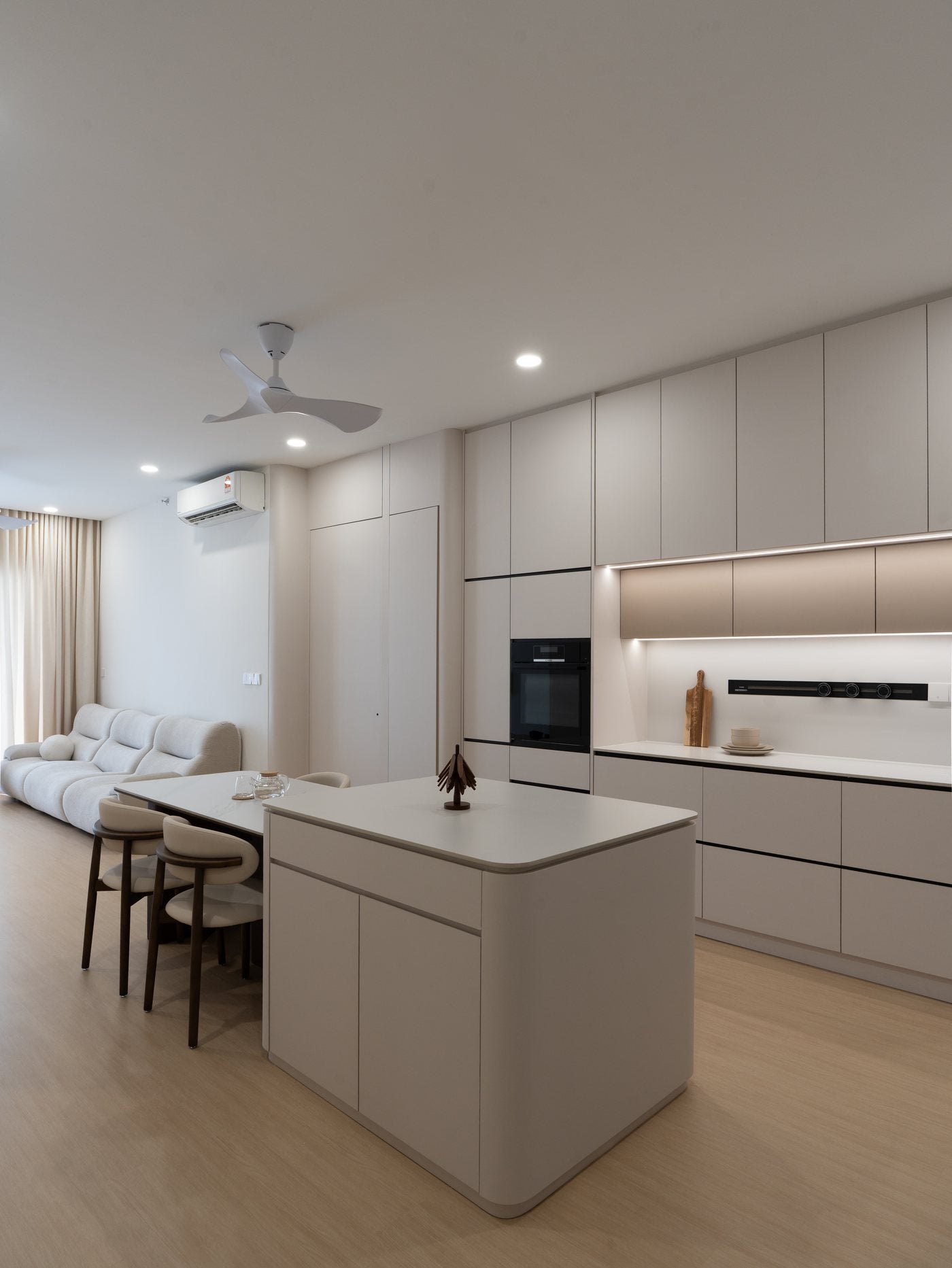 Kitchen island with dark timber base and stone top, condo interior design KL