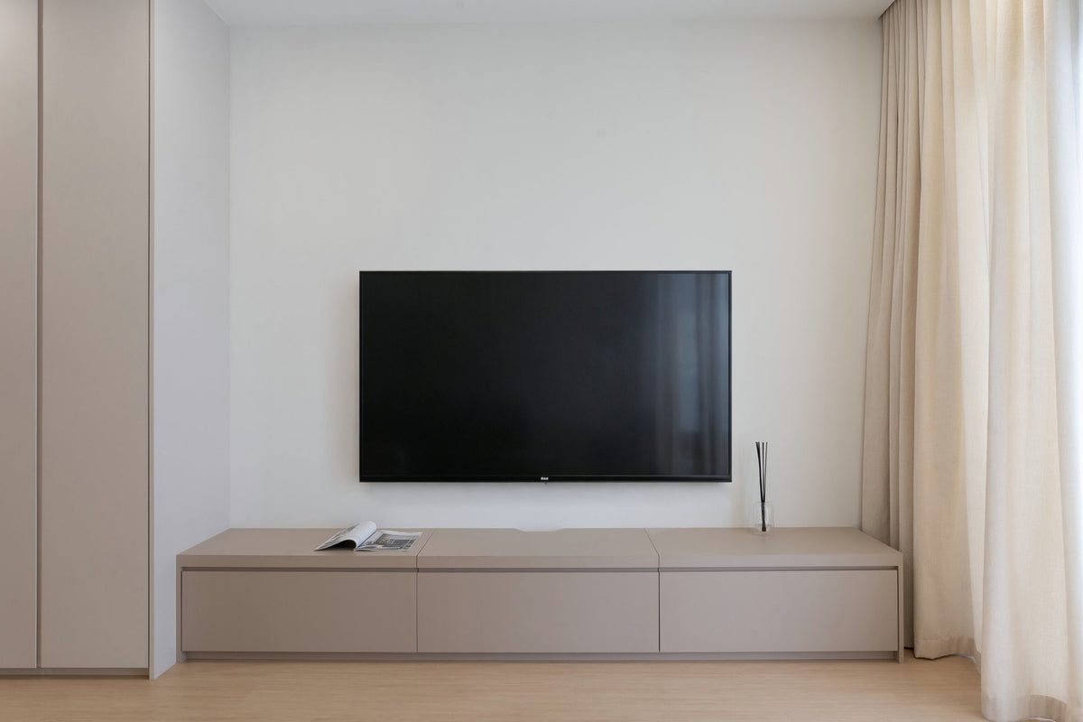 Floating TV console on a cream feature wall