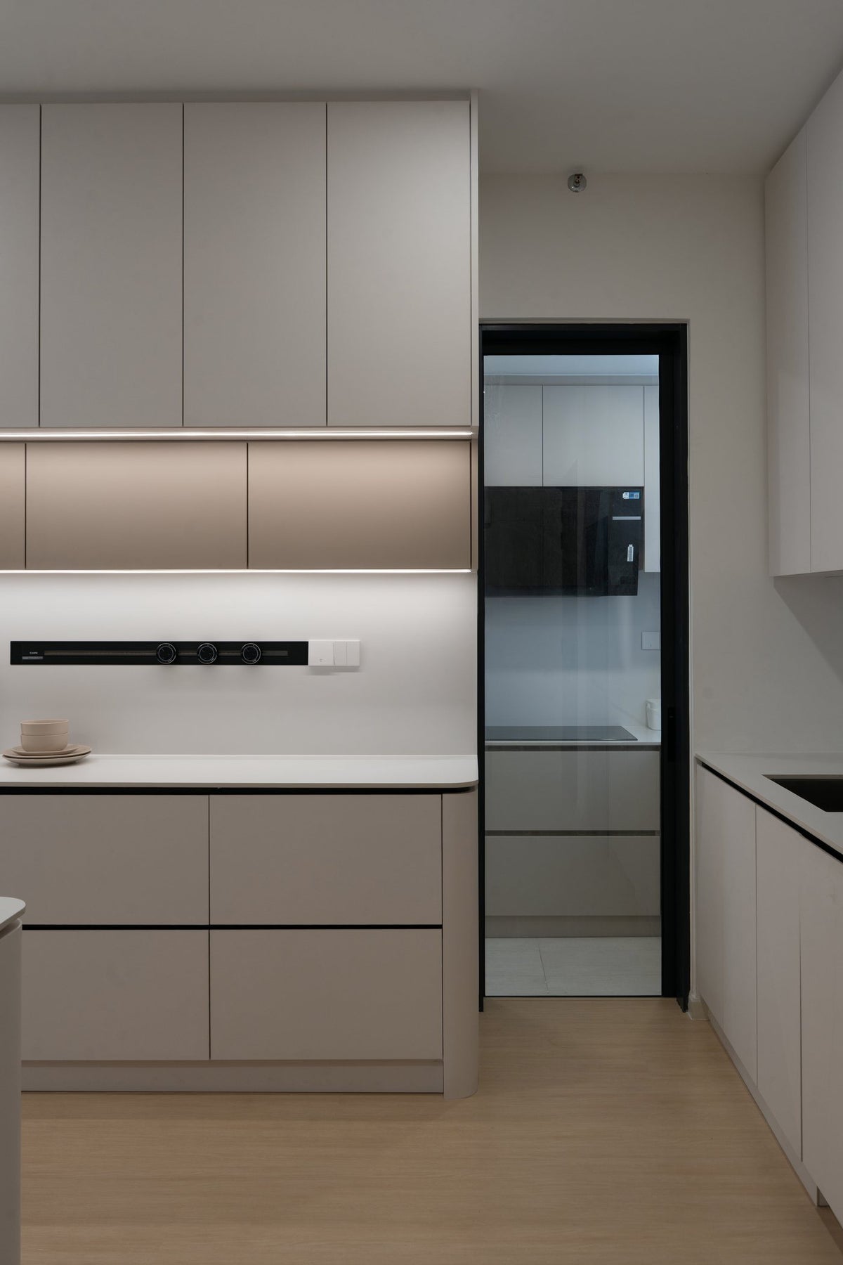 Kitchen cabinets with under-cabinet lighting and built-in oven