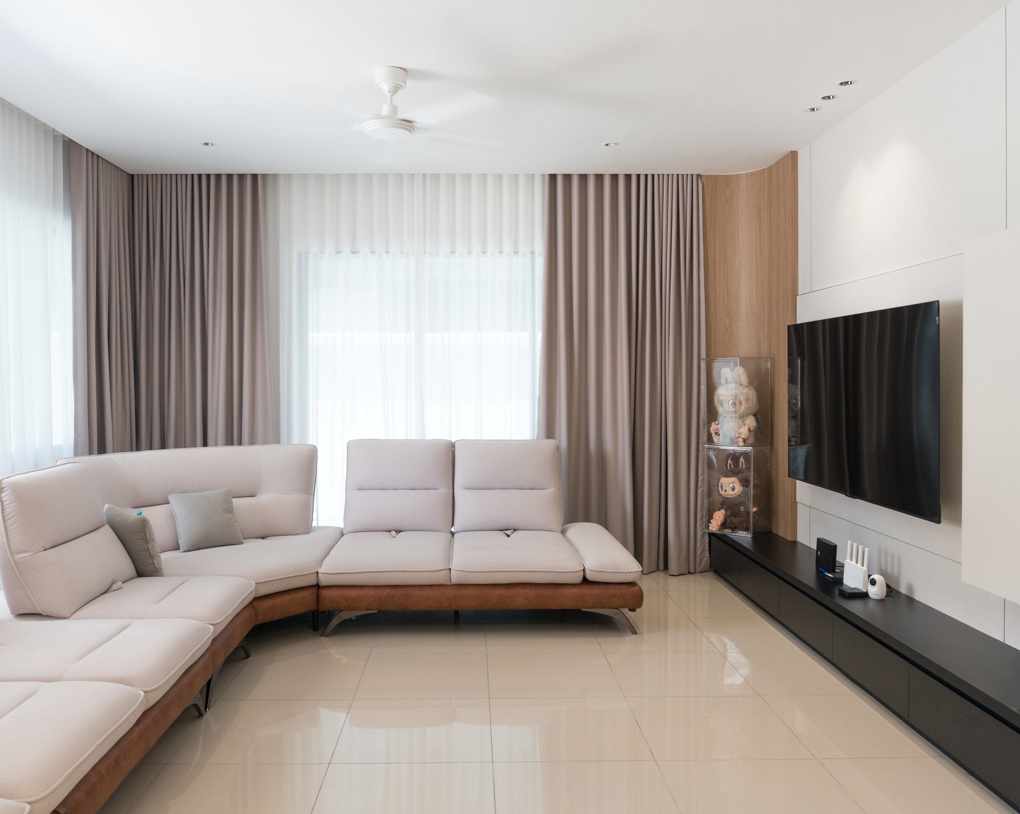White panelled living hall with timber band and TV wall, landed home interior design Hulu Langat