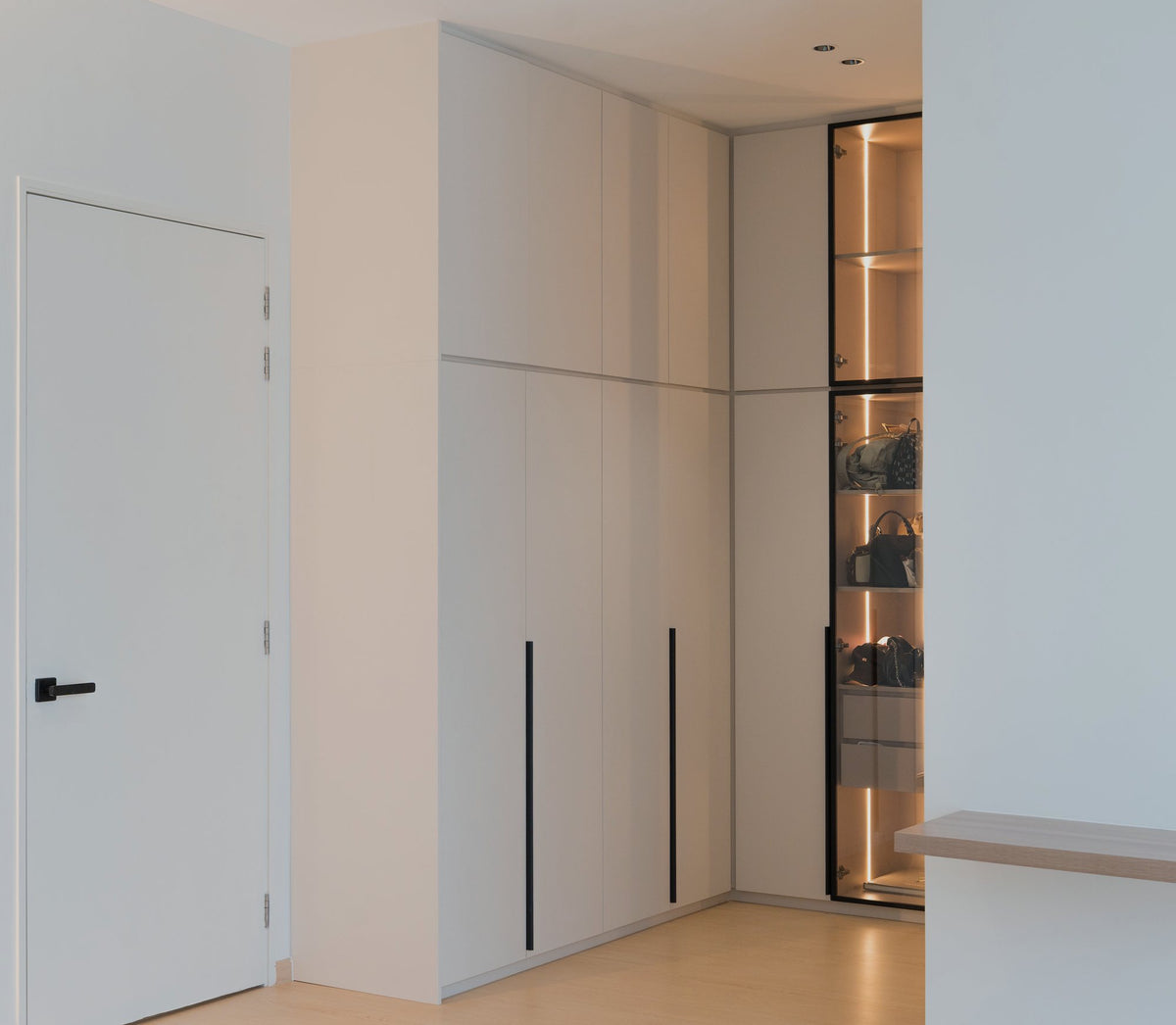 Lit glass display cabinet built into the cabinetry