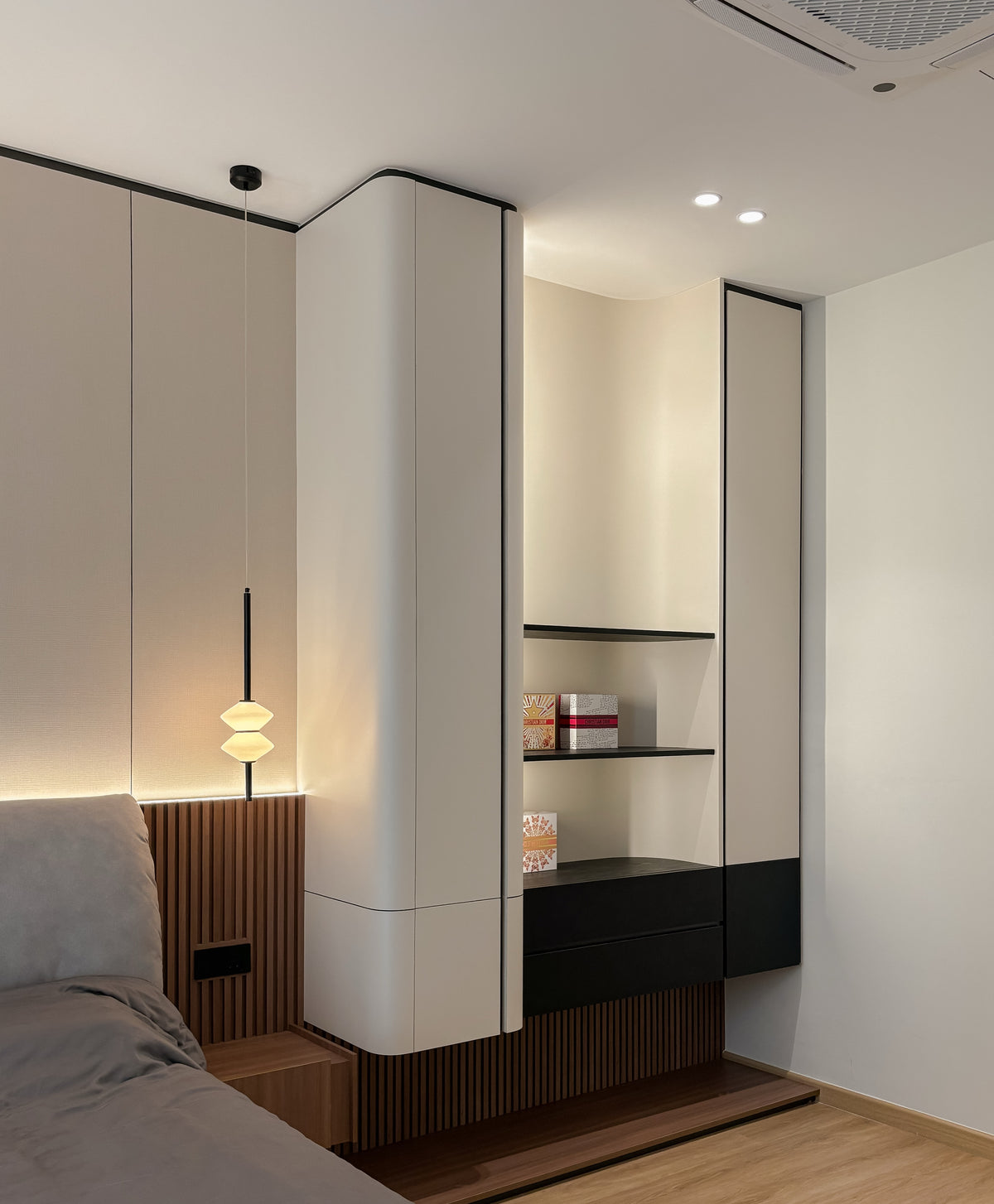 Bedroom wardrobe with curved display niche